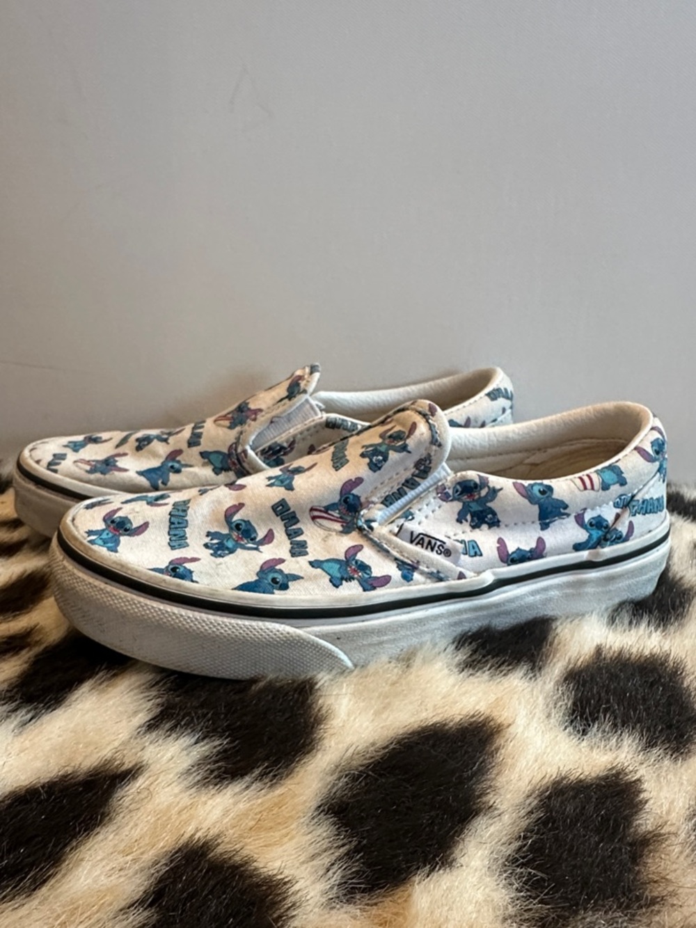 Vans Kids Slip-On Sneakers in White with Blue Stitch Print